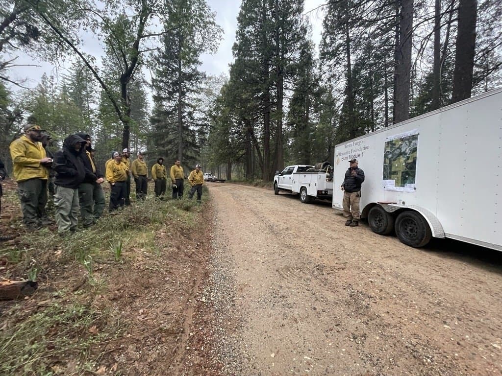 Terra Fuego prescribed fire personnel lined up for the morning briefing, March 31, 2026.